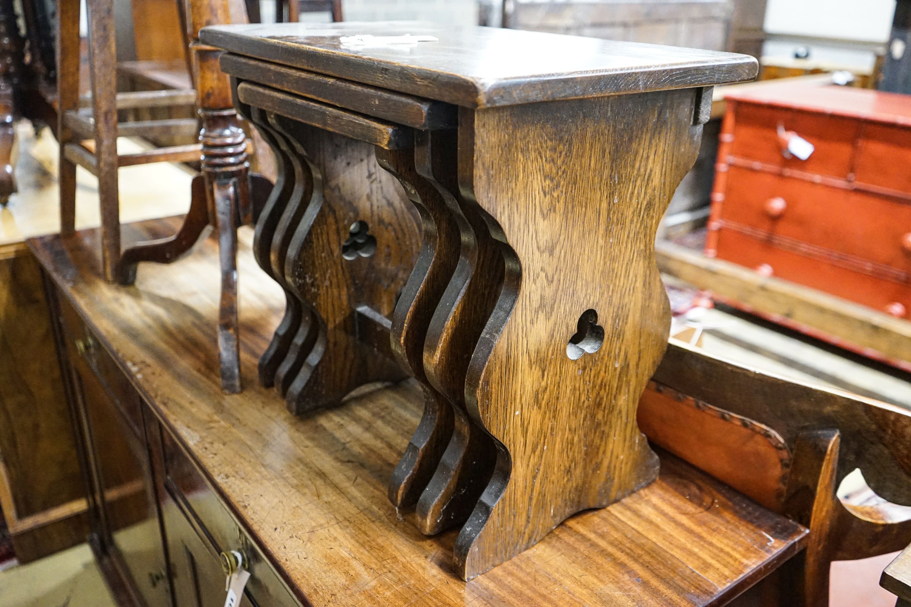 A 19th century circular mahogany tripod wine table, diameter 45cm, height 74cm, together with a nest of tea tables, and a provincial tall oak stool